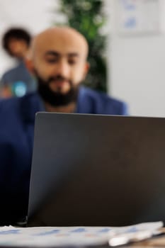 Arab company entrepreneur attending video call investor using laptop