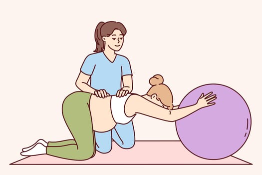 Gymnastics for pregnant women under supervision of physiotherapist to help prepare for childbirth