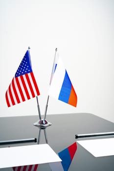 Flags of Usa and Russia on negotiation table