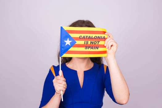Catalan woman with estelada flag. Referendum For The Separation Of Catalonia From Spain. Democracy Independence Concept.