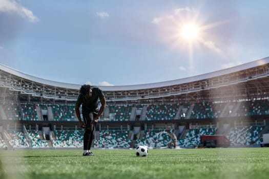 Professional male football, soccer player on stadium background.