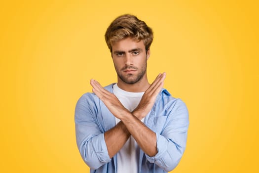 European man with no gesture on yellow background.