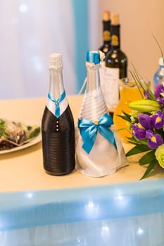 Decorated wedding bottle of champagne