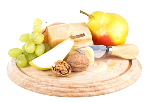 parmesan cheese, nuts and ripe pears on a wooden board on a white background