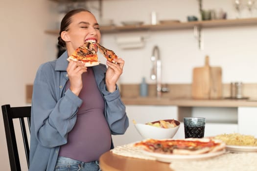 Joyful pregnant woman biting two pizza slices