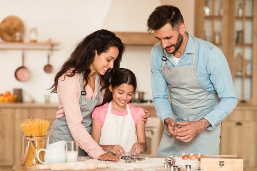 Family baking together in a cozy kitchen