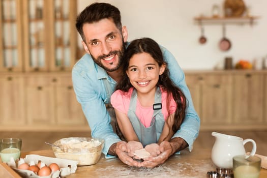 Father and daughter sharing a baking moment