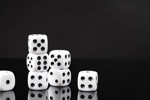 White dice on black background studio shot