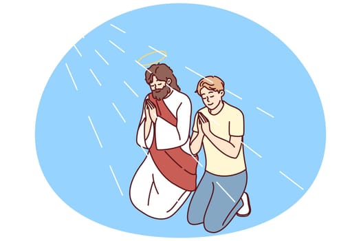 Religious man pray kneeling with Jesus Christ