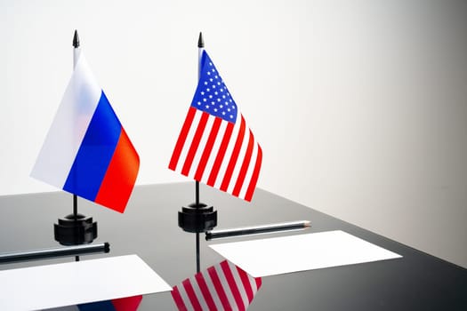 Flags of Usa and Russia on negotiation table