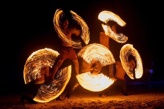 Beachside entertainment. a fire performance on a beach in Thailand.