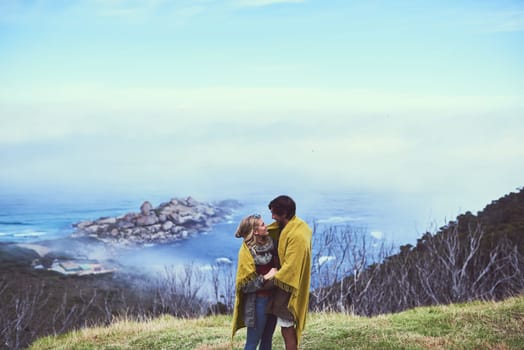 The most beautiful view out here is you. an affectionate young couple enjoying a hike in the mountains.