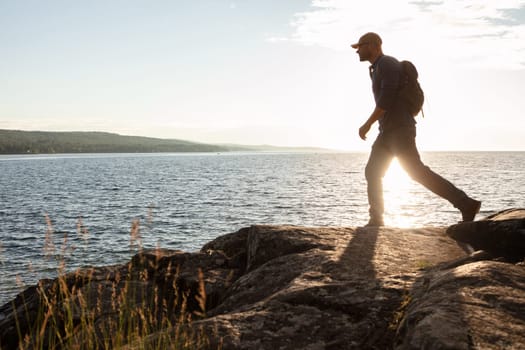 Experience the true freedom of movement. a man wearing his backpack while out for a hike on a coastal trail.