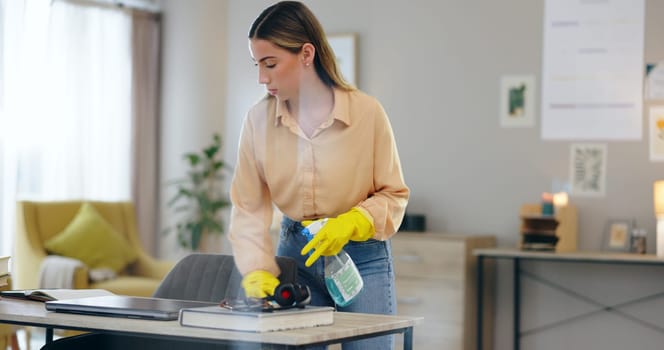 Woman, spray bottle and cleaning table in house, disinfection and maintenance service or fluid. Female person, gloves and antibacterial or detergent, chemical and hygiene or bacteria in home office