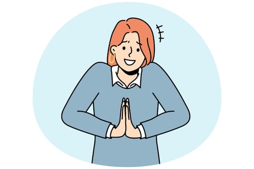 Smiling woman hold hands in prayer ask for favor