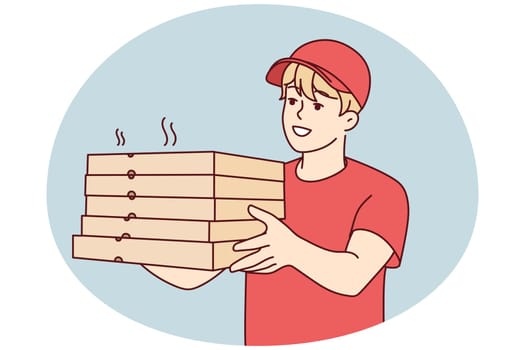 Smiling deliveryman with pizza boxes