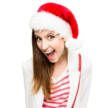 Lets crank up this Christmas party. a young woman in the christmas spirit against a studio background.