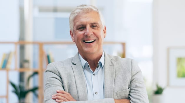 Portrait, arms crossed and happy senior business man in office with confidence, mindset or positive attitude. Face, smile or old male ceo with pride, laugh or excited at startup advertising agency