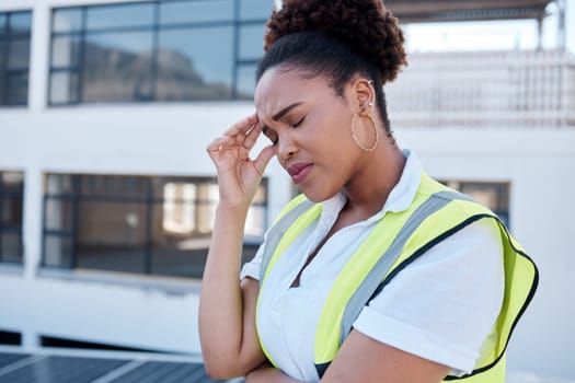 Face, sad and woman in construction with headache at renovation site, civil engineering mistake and stress. Confused, tired and frustrated african contractor with burnout, crisis and problem in city