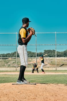 A really good pitcher is tough to beat. a young baseball player getting ready to pitch the ball during a game outdoors.