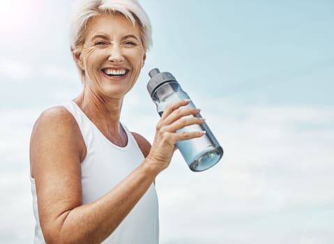 Senior woman, fitness and water bottle with smile for hydration or thirst after workout, exercise or training in nature. Portrait of happy elderly female smiling for natural refreshment on mockup