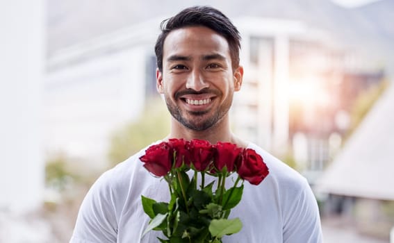 Smile, portrait and happy man with bouquet of roses for date, romance and hope for valentines day. Love confession, romantic gift and person holding flowers outside in city for proposal or engagement.