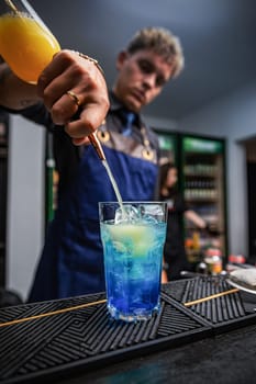 Professional bartender making cocktail 