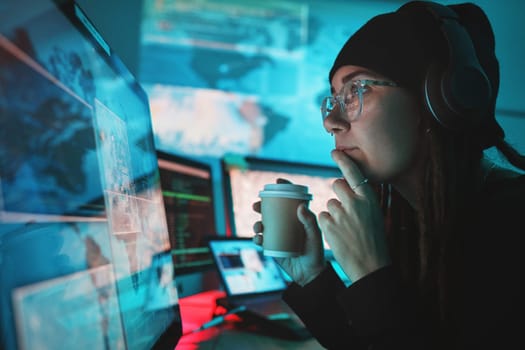 Woman, hacker and computer with thinking, night and coffee for analysis, cyber crime and ideas with monitor. Information technology expert, screen and dashboard with ransomware with phishing for data