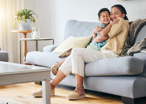 Living room hug, relax or happy mom, child and smile for family relationship, Mothers Day affection or care. Lounge couch, embrace and excited mama, mum or woman bonding with kid in home quality time