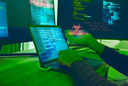Cybersecurity, crime and hands of hacker with virus in neon office with code, fraud and danger. Software, ransomware and web programmer on cyber attack, password thief coding online scam and hacking.