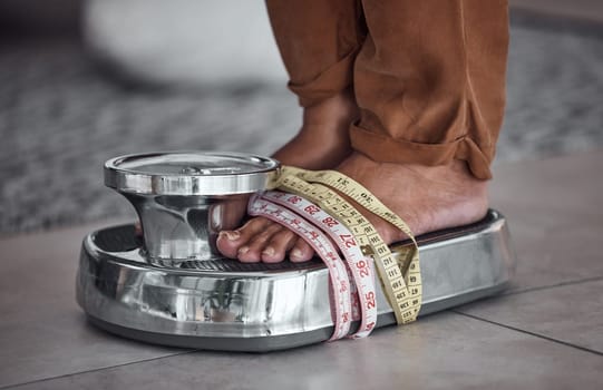 Feet, anorexia and person on scale with tape measure to check body to lose weight with stress. Balance, foot and results of diet, unhealthy obsession and eating disorder at home, counting calories