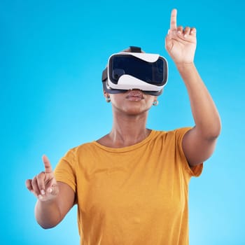 Black woman, press on screen with metaverse and virtual reality, future technology and 3D on blue background. User experience, VR goggles and female person, digital world and video game in studio.