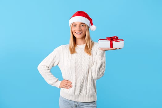 Happy woman presenting a gift