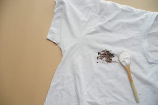 removing stain on clothes with biocarbonat.