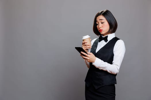 Waitress with coffee chatting online