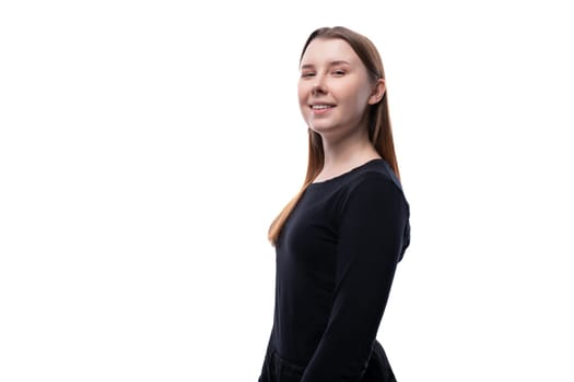Portrait of a cute Caucasian pre-teen girl wearing a black turtleneck on a white background