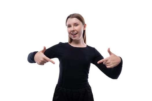 Positive pre-teen girl wearing a black turtleneck on a white background