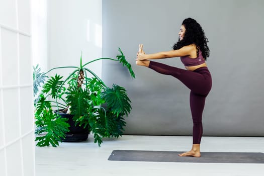 a leg stretching exercises yoga trainer gymnastics acrobatics woman