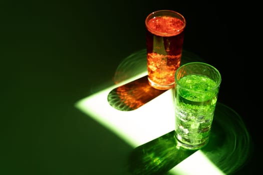 Summer alcohol cocktail in sun light beam