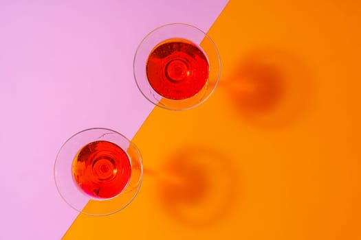 Refreshing pink punch cocktail on color background