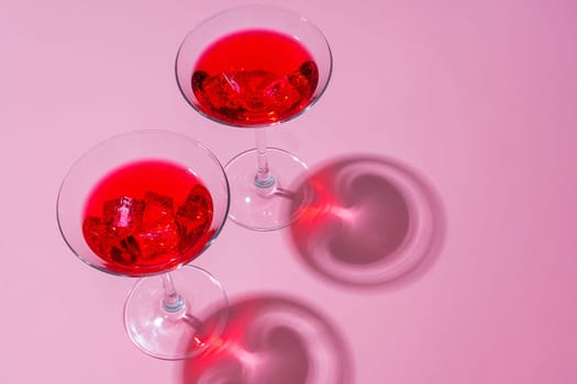 Cold and refreshing cocktails on color background
