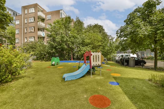 a backyard with a playground and a swing set