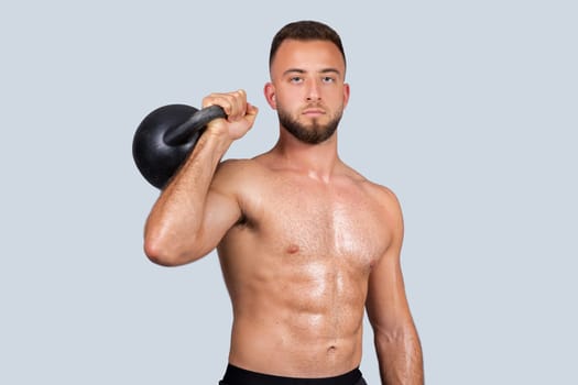 Calm attractive sweat strong muscular millennial caucasian guy with beard