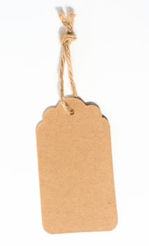 Blank brown rectangular brown paper tag on a rope  on white background, template for price, discount