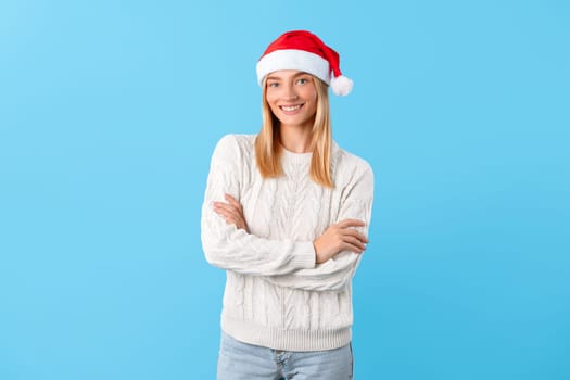 Joyful caucasian lady in Santa hat smiling