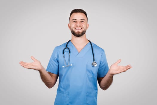 Male nurse with open hands in a welcoming pose