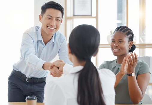 Handshake, office and success with partnership deal together at corporate company meeting. Professional b2b agreement and negotiation with cheerful clapping applause in office workplace.