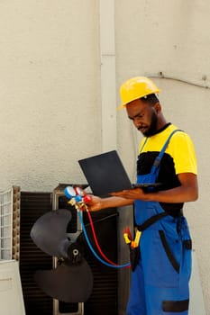 Technician fixing ice in air conditioner