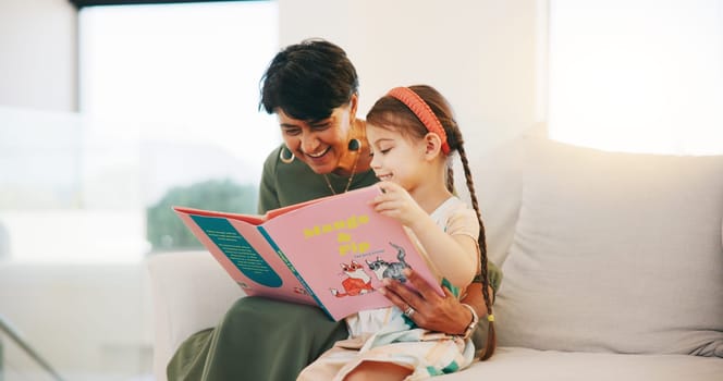 Happy grandmother, child and reading book on sofa for literature, education or bonding together at home. Grandparent with little girl smile for story, learning or relax on living room couch at house