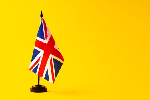 Flag of Great Britain Union Jack on flagpole studio shot
